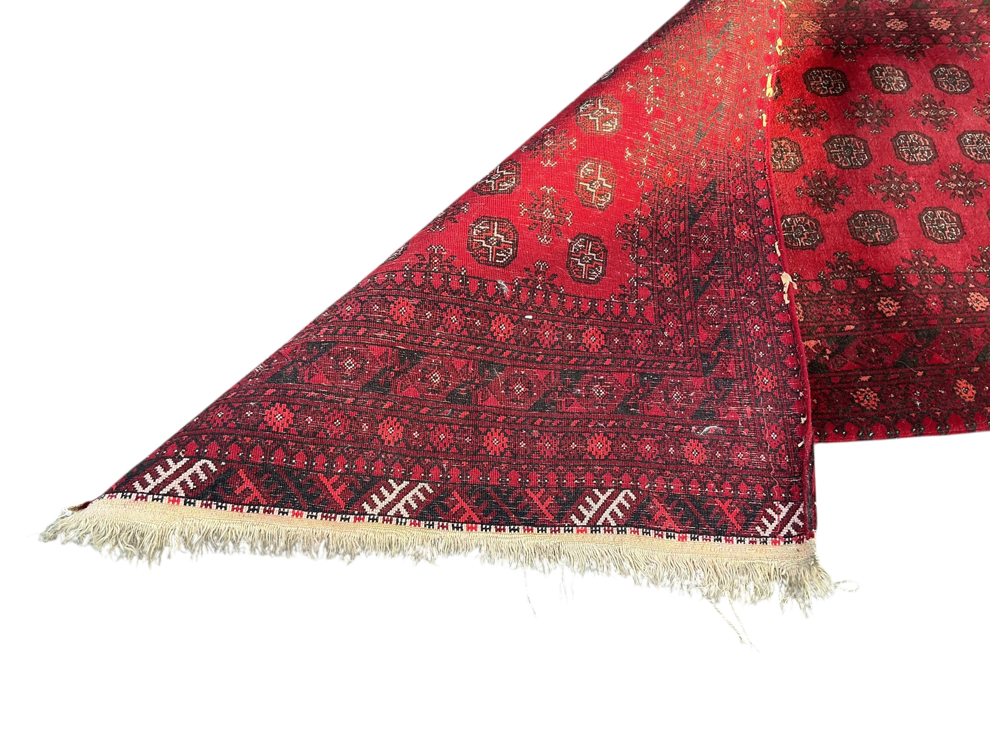 A Bokhara red ground runner, 290 x 80cm